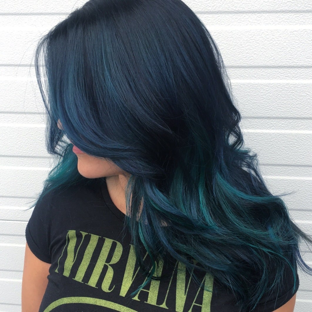 13. Midnight Black Hair with Teal Face-Framing Layers - Teal Hair Color
