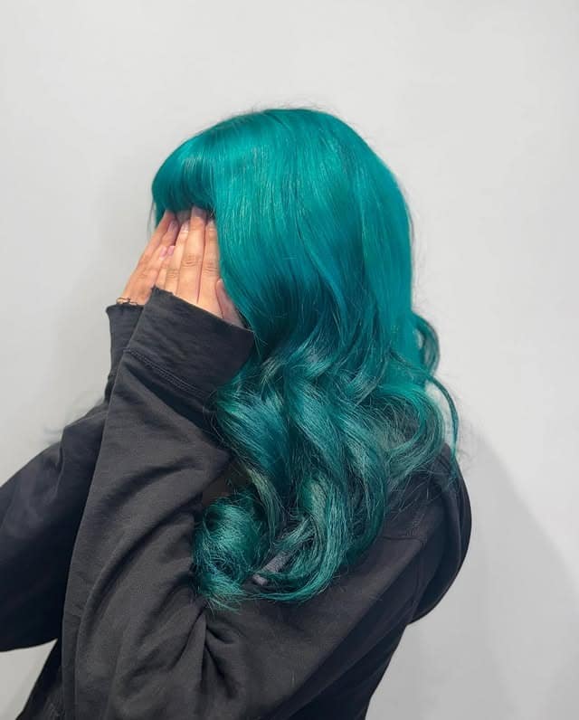 16. Bright Teal Hair with Full Bangs - Teal Hair Color