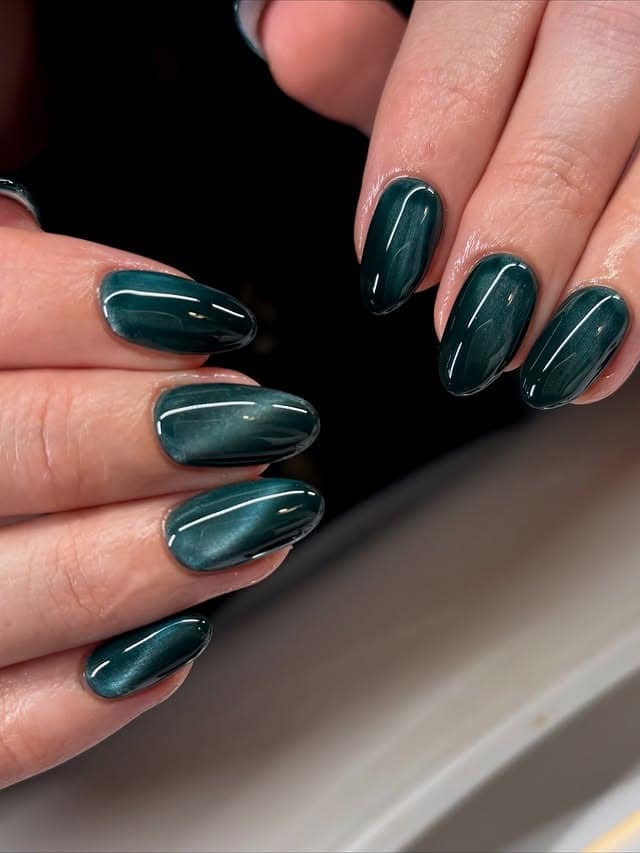 14. Dark Green Velvet Cat Eye Almond Nails - dark green nail ideas