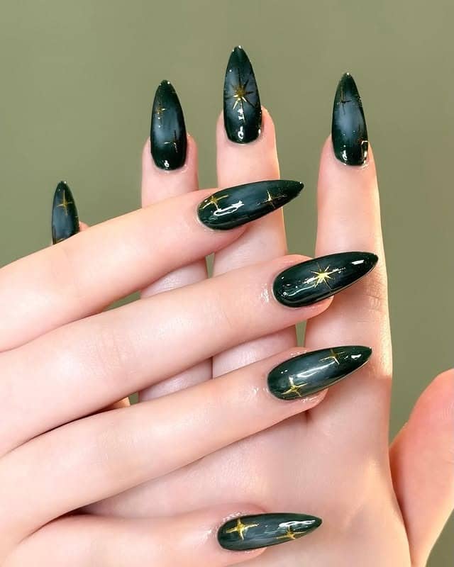 15. Dark Green Celestial Almond Nails - dark green nail ideas