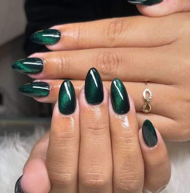 16. Emerald Green Cat Eye Oval Nails - dark green nail ideas