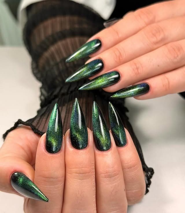 20. Dark Green Magnetic Stiletto Nails - dark green nail ideas