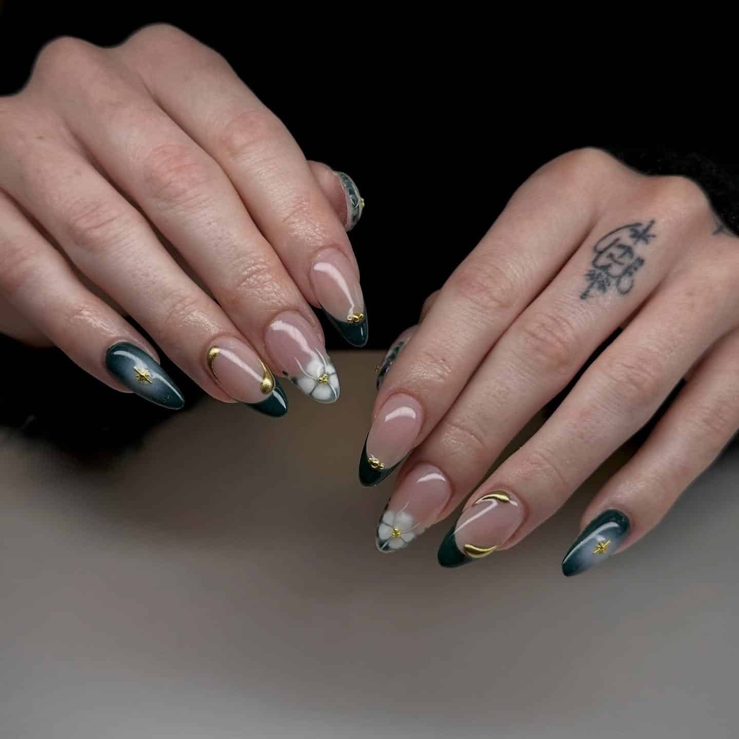 1. Emerald Green French Tip Almond Nails with White Floral Accent - fancy nail ideas