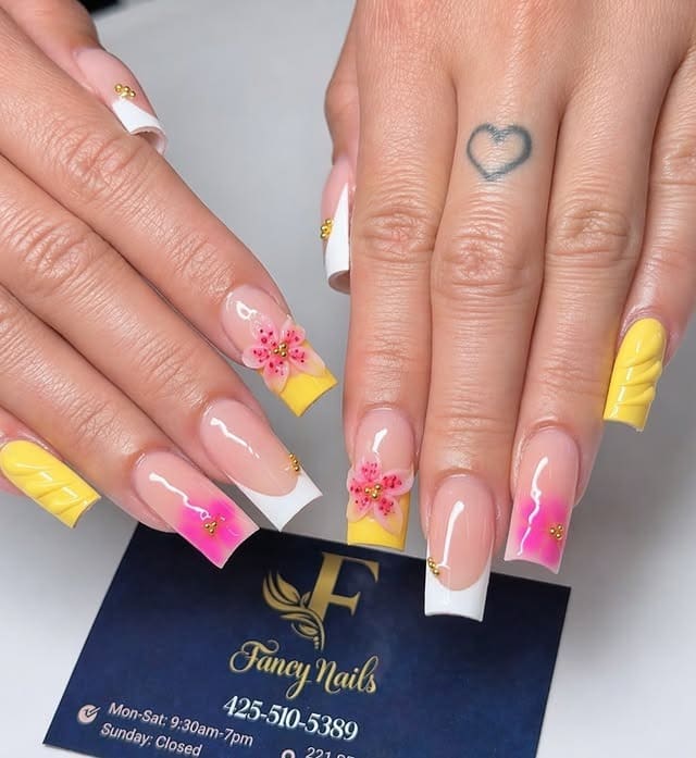 5. Yellow French Tip Square Nails with Pink Flowers - fancy nail ideas