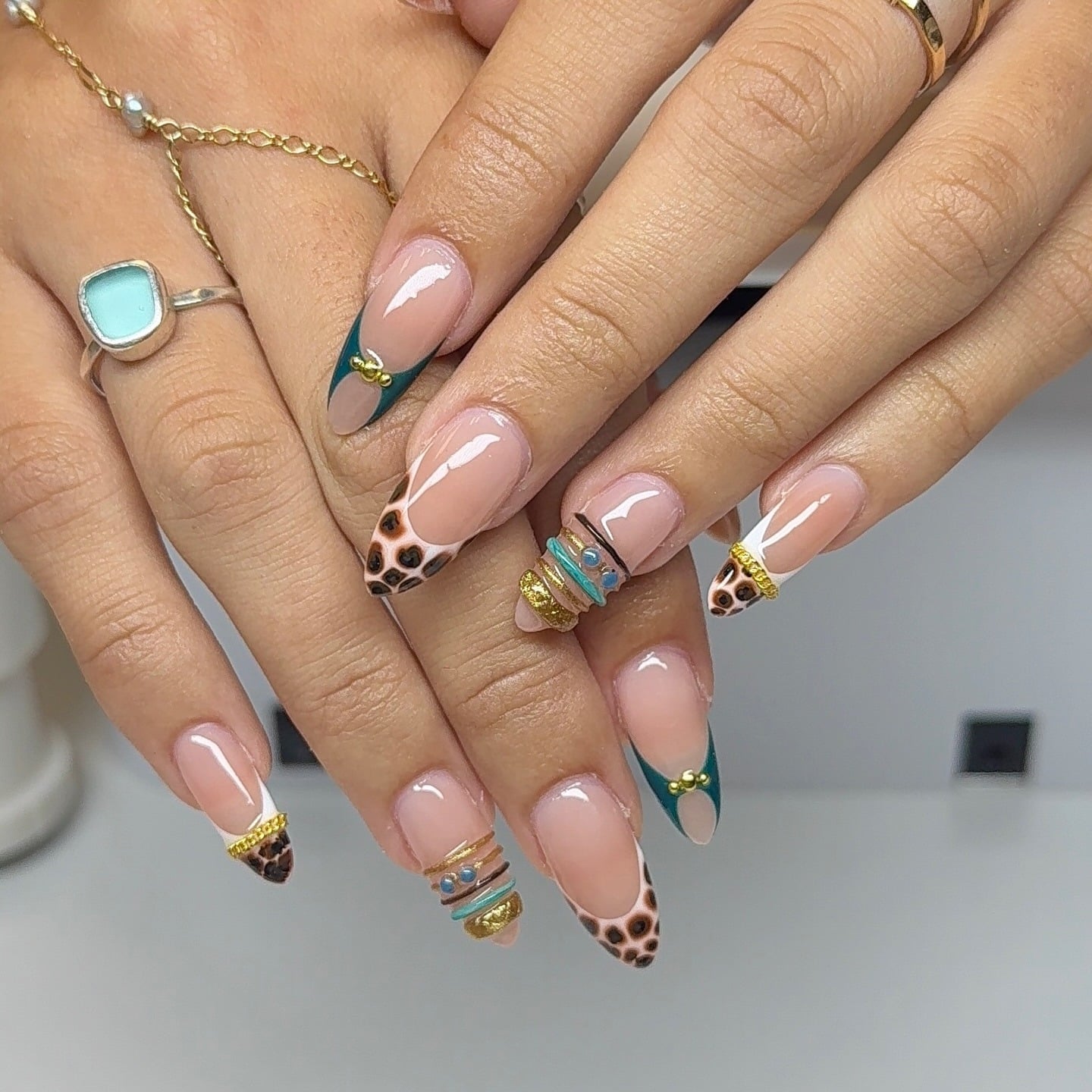 9. Leopard French Tip Almond Nails with Teal Accents - fancy nail ideas