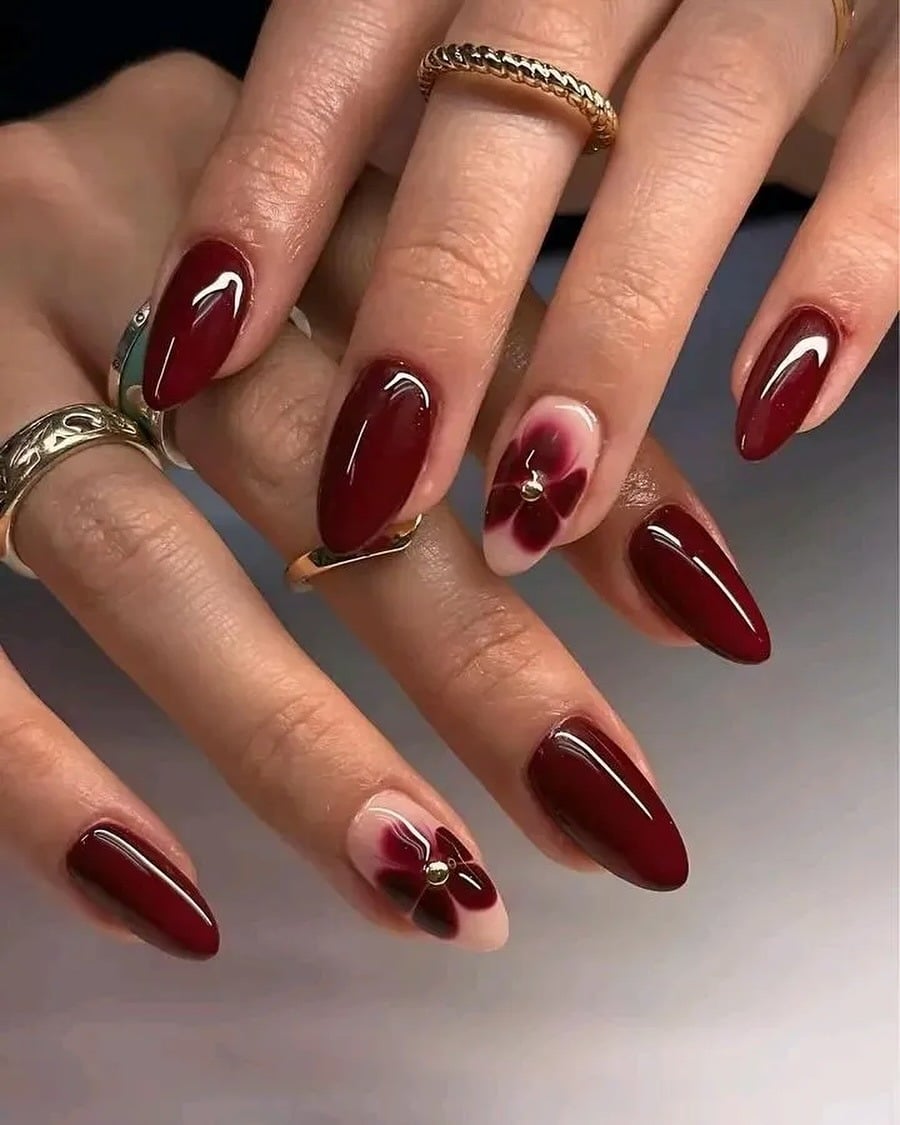 15. Deep Burgundy Almond Nails with Floral Accent Design - fancy nail ideas