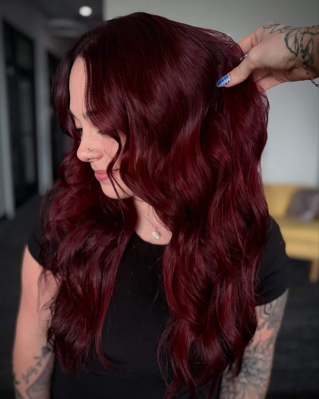 1. Deep Burgundy Waves with Curtain Bangs - Baddie Hairstyles
