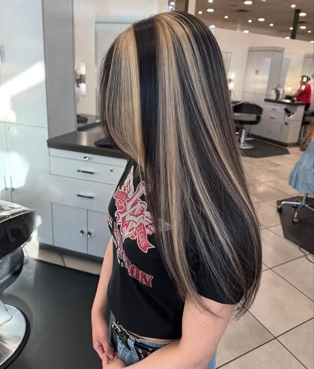 3. Black Hair with Bold Blonde Money Piece - Baddie Hairstyles
