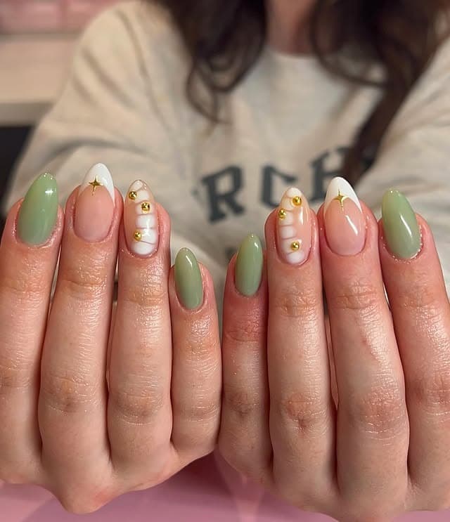 1. Sage Green Almond Nails with Gold Star Accents - march nail ideas