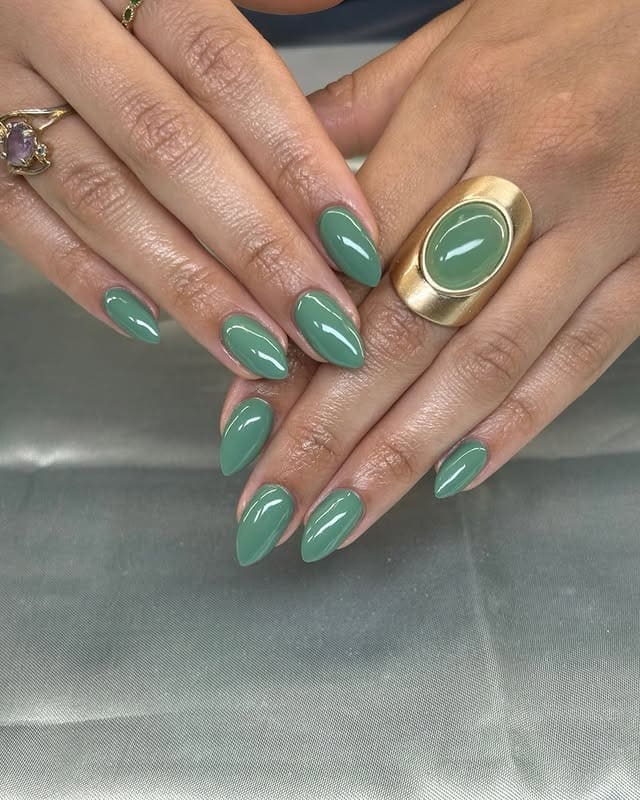 11. Glossy Sage Green Almond Nails - march nail ideas