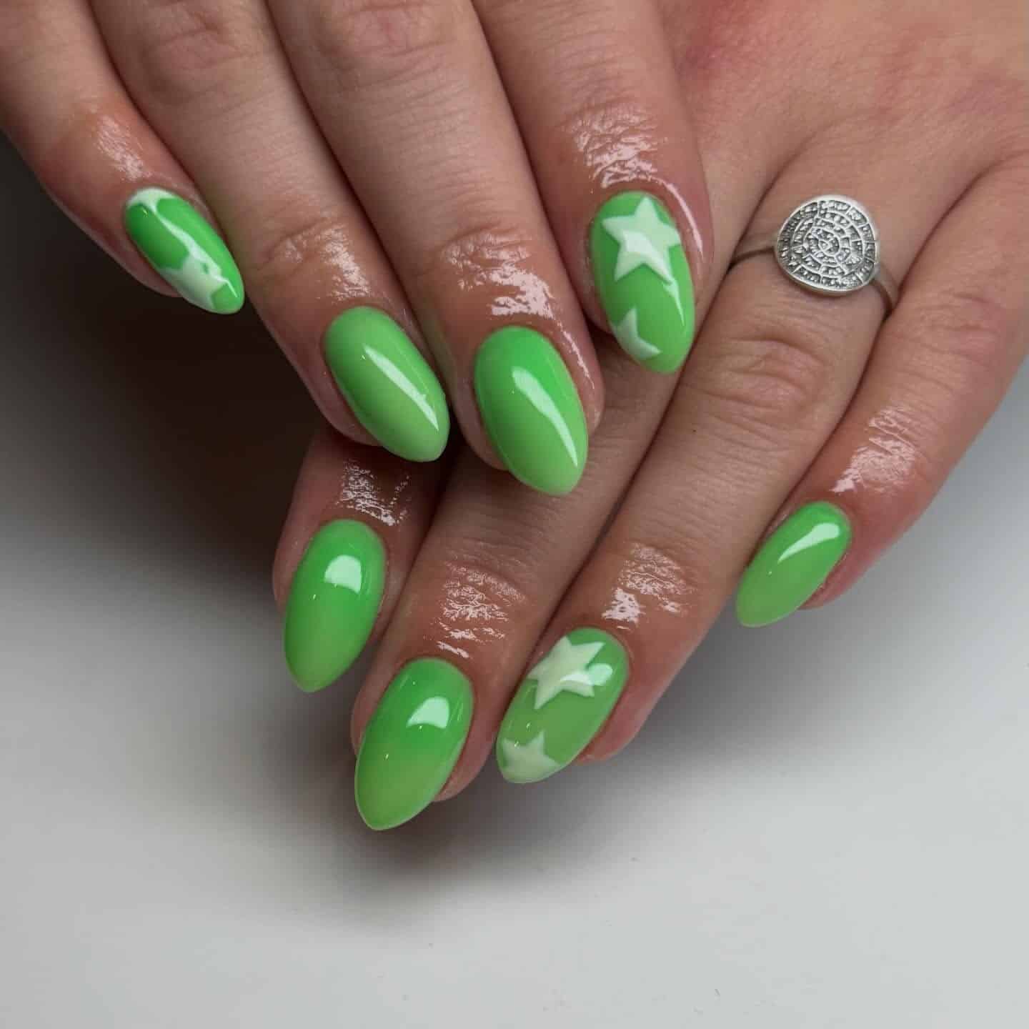 16. Bright Green Star Almond Nails - march nail ideas