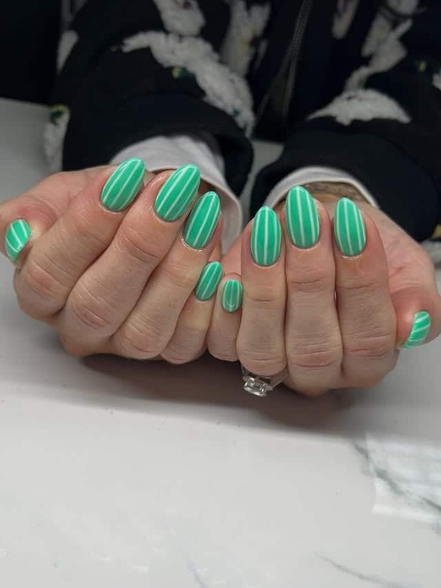 22. Mint Green Striped Oval Nails - march nail ideas