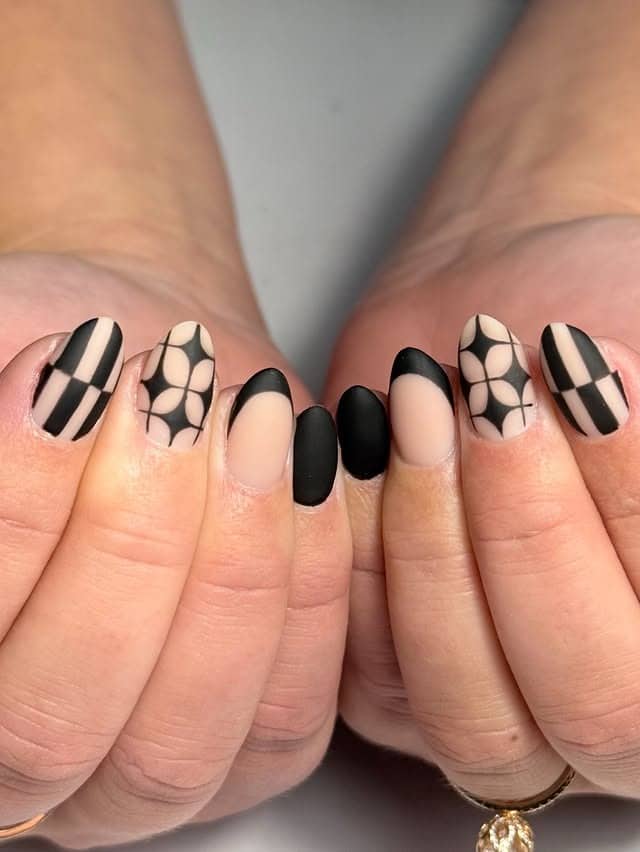 17. Matte Black Abstract Short Almond Nails - matte nail ideas