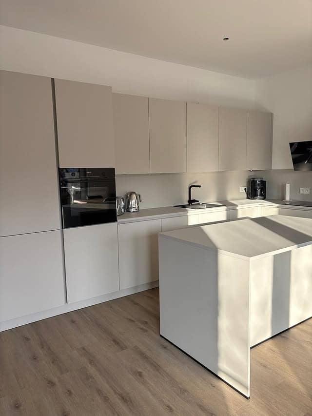 6. Minimalist Kitchen Ideas with Matte White Cabinets - minimalist kitchen ideas