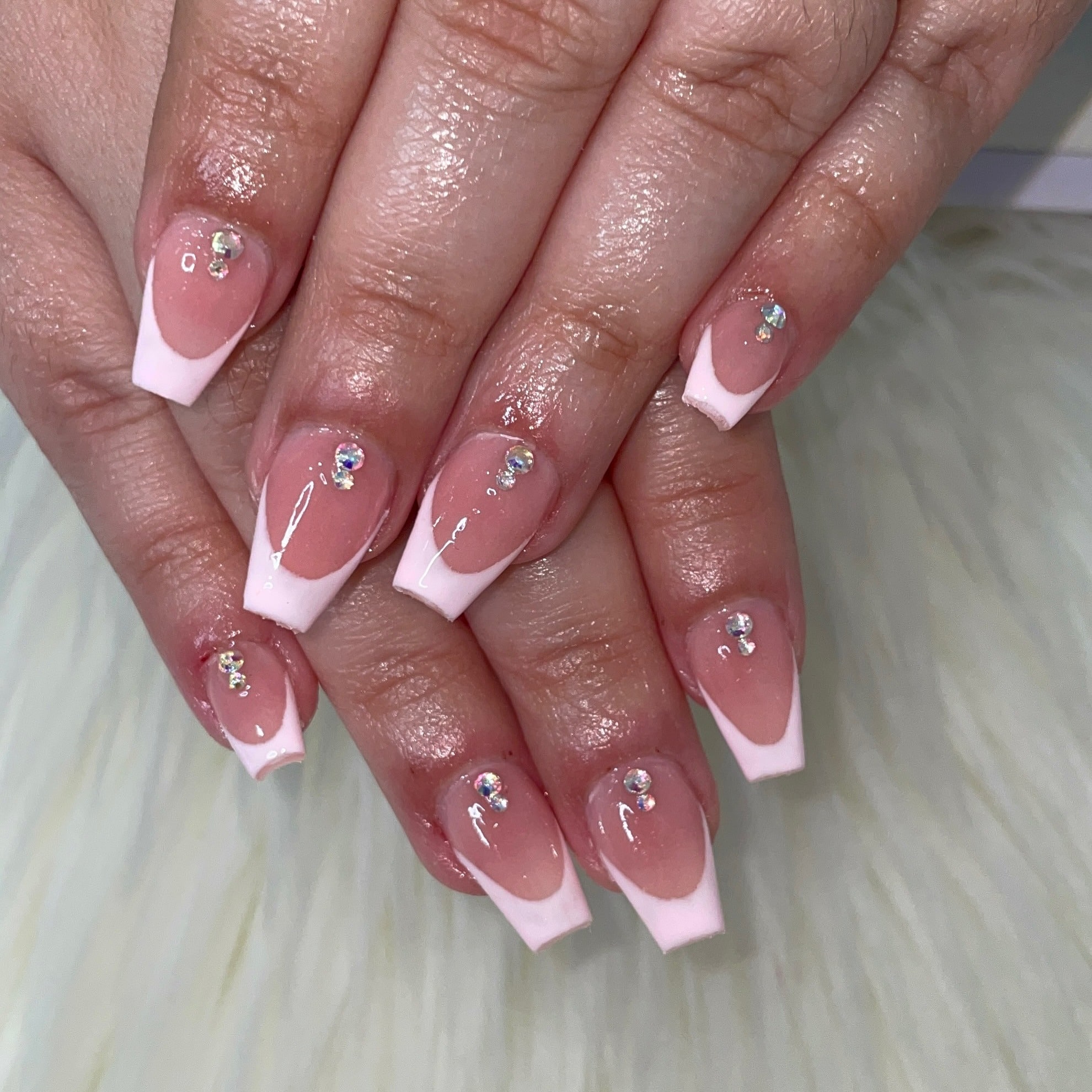 10. Baby Pink French Tip Short Coffin Nails with Rhinestones - short coffin nail ideas