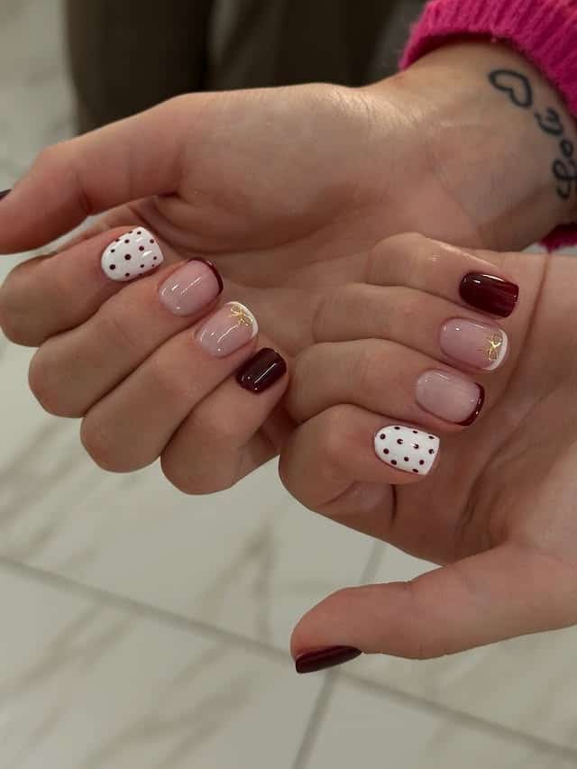 11. Burgundy French Tip Short Coffin Nails with Polka Dots - short coffin nail ideas