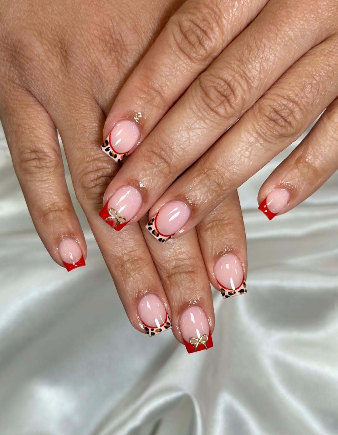 12. Red French Tip Short Coffin Nails with Leopard Accents - short coffin nail ideas