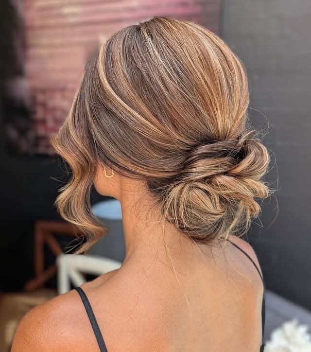 3. Sleek Low Bun with Beige Blonde Balayage - Bun Hairstyles