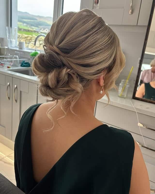 6. Elegant Twisted Low Bun with Ash Blonde Highlights - Bun Hairstyles