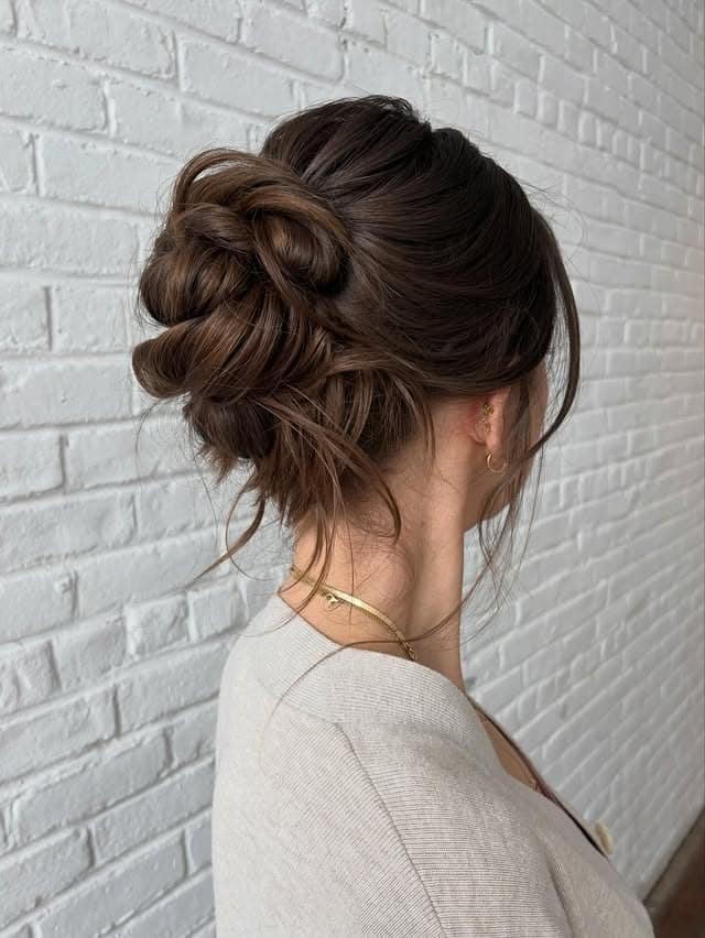 9. Voluminous Textured Bun with Light Chestnut Brown Hair - Bun Hairstyles