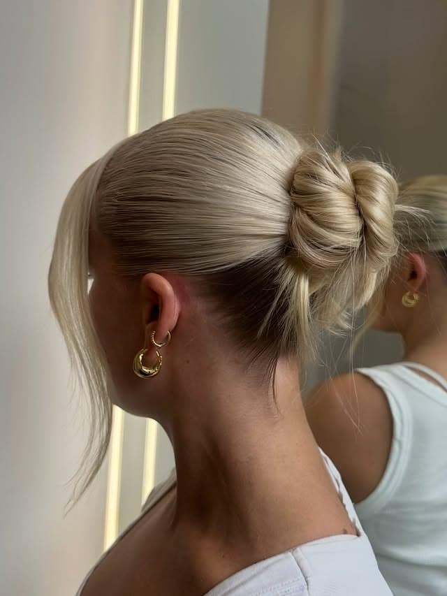 15. Sleek Knotted Bun with Icy Blonde Hair - Bun Hairstyles