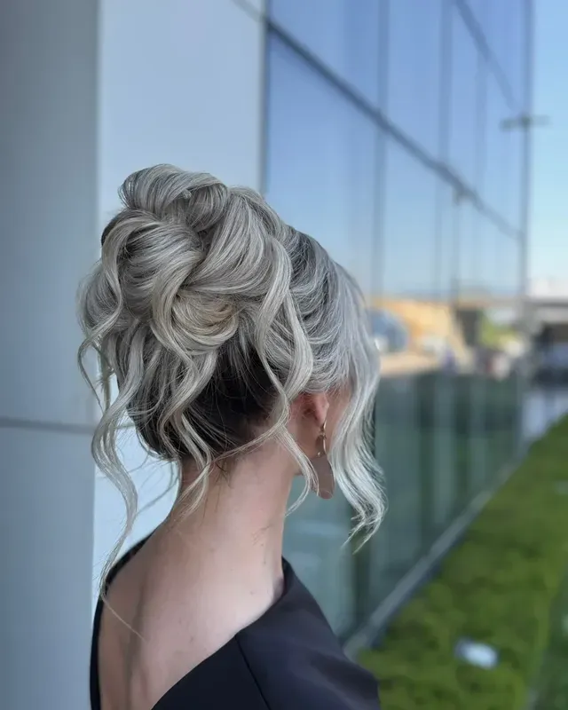 16. Voluminous High Bun with Silver Blonde Hair - Bun Hairstyles