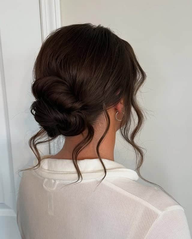 19. Elegant Rolled Low Bun with Deep Chestnut Brown Hair - Bun Hairstyles