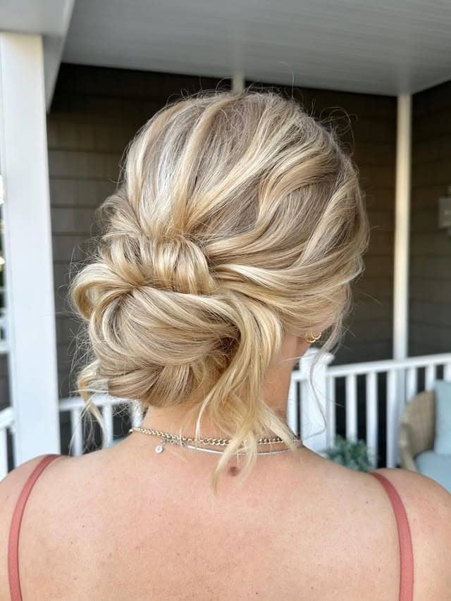 21. Romantic Low Bun with Creamy Blonde Balayage - Bun Hairstyles