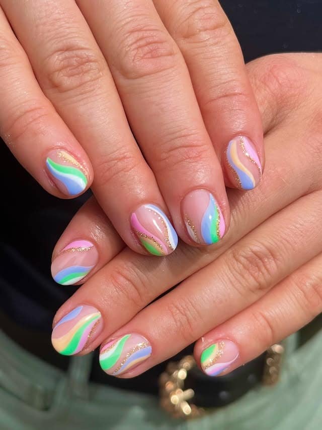 1. Pastel Rainbow Swirl Nails with Gold Accents - swirl nail ideas