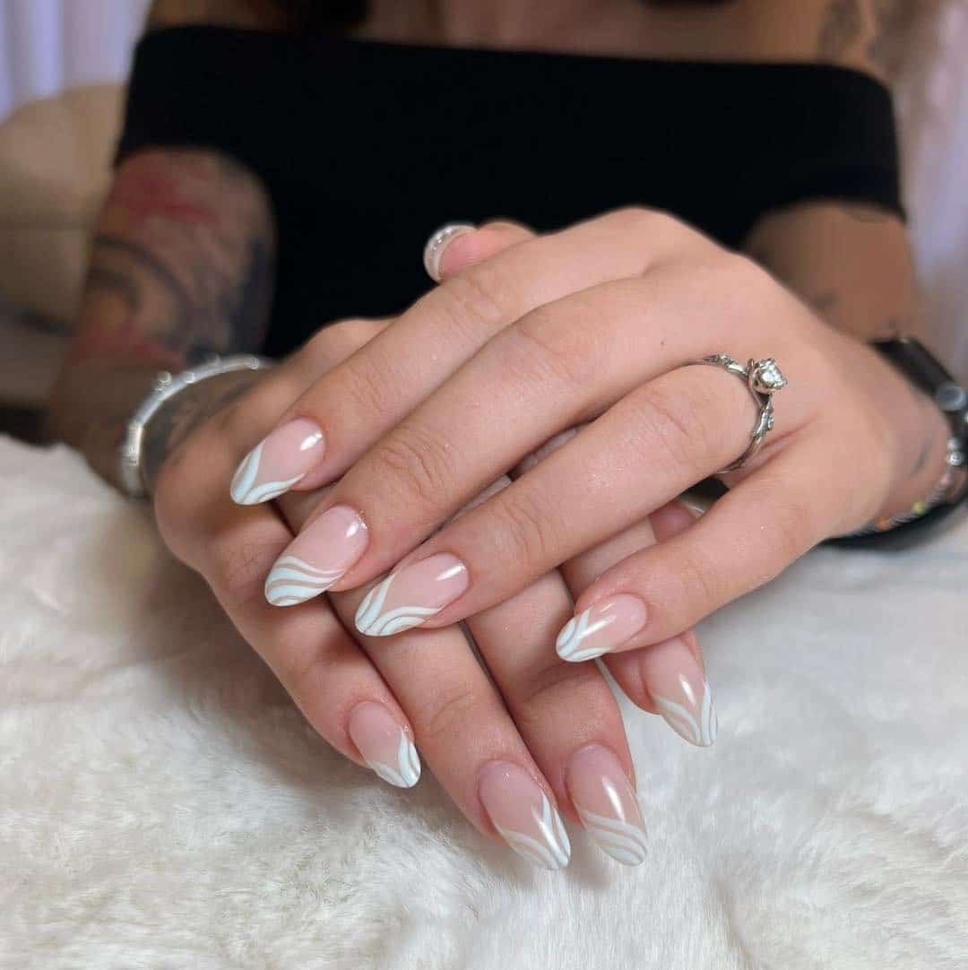 4. Soft White Swirl French Almond Nails - swirl nail ideas