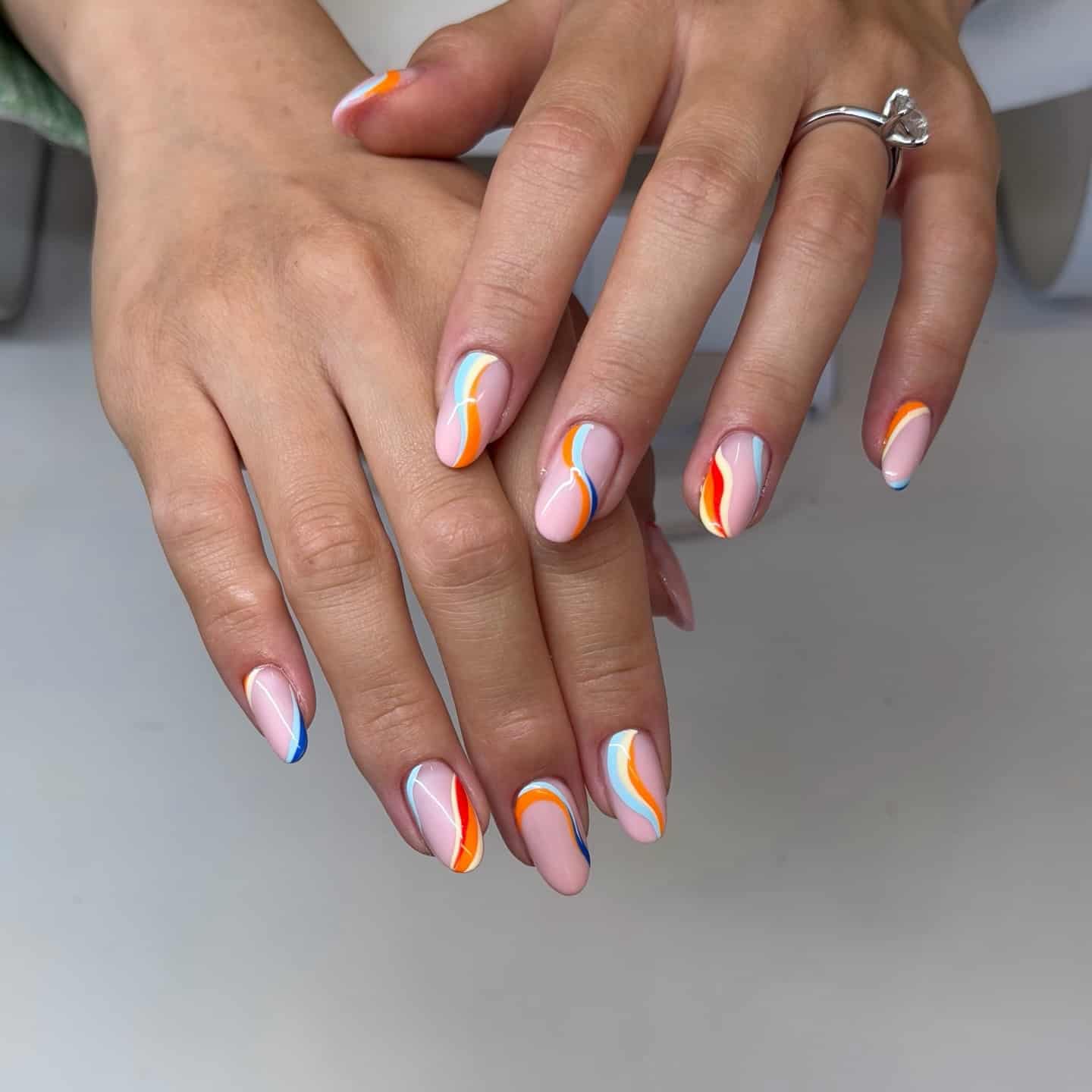 8. Coral and Blue Abstract Swirl Nails - swirl nail ideas