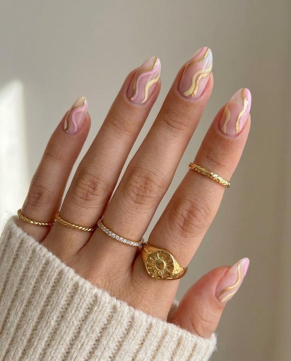 12. Blush Pink and Gold Swirl Almond Nails - swirl nail ideas