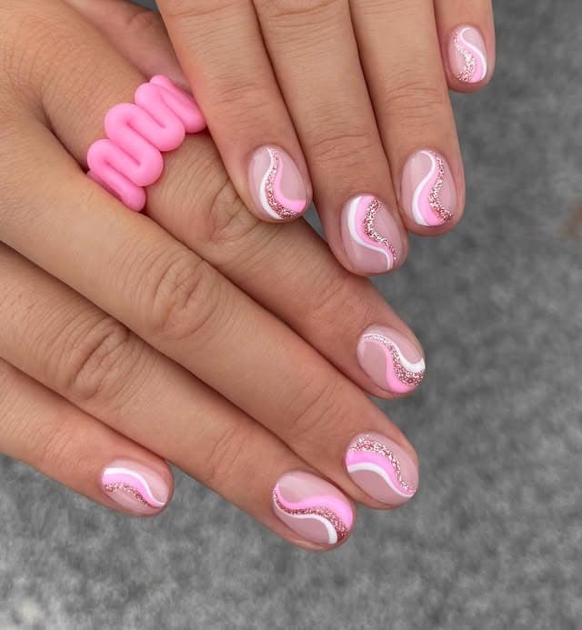 16. Pink Glitter Swirl Short Nails - swirl nail ideas