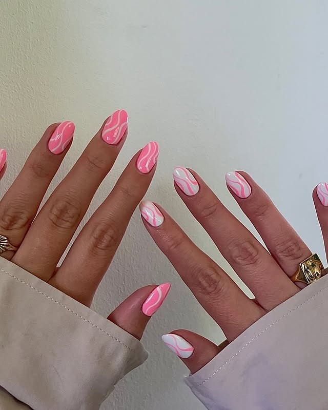 19. Bubblegum Pink Swirl Almond Nails - swirl nail ideas