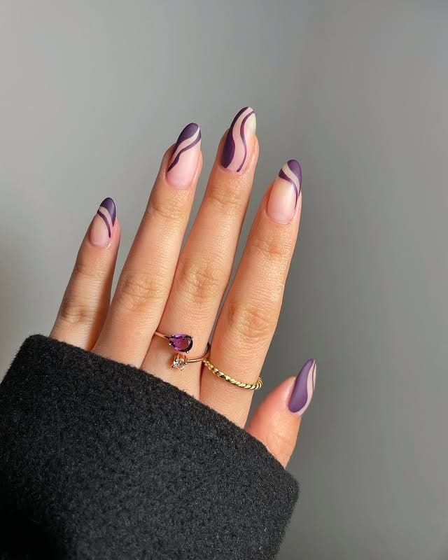 22. Plum Purple Swirl Almond Nails - swirl nail ideas