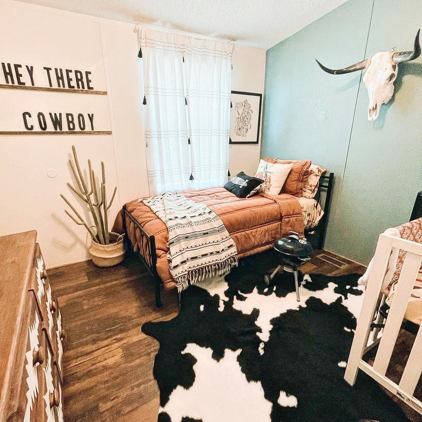 7. Small Western Bedroom Ideas with Sage Green Accent Wall - western bedroom ideas