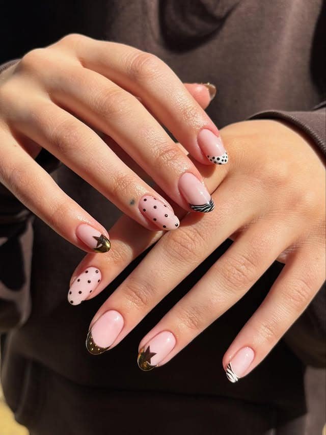 10. Black French Abstract Almond Nails - april nail ideas