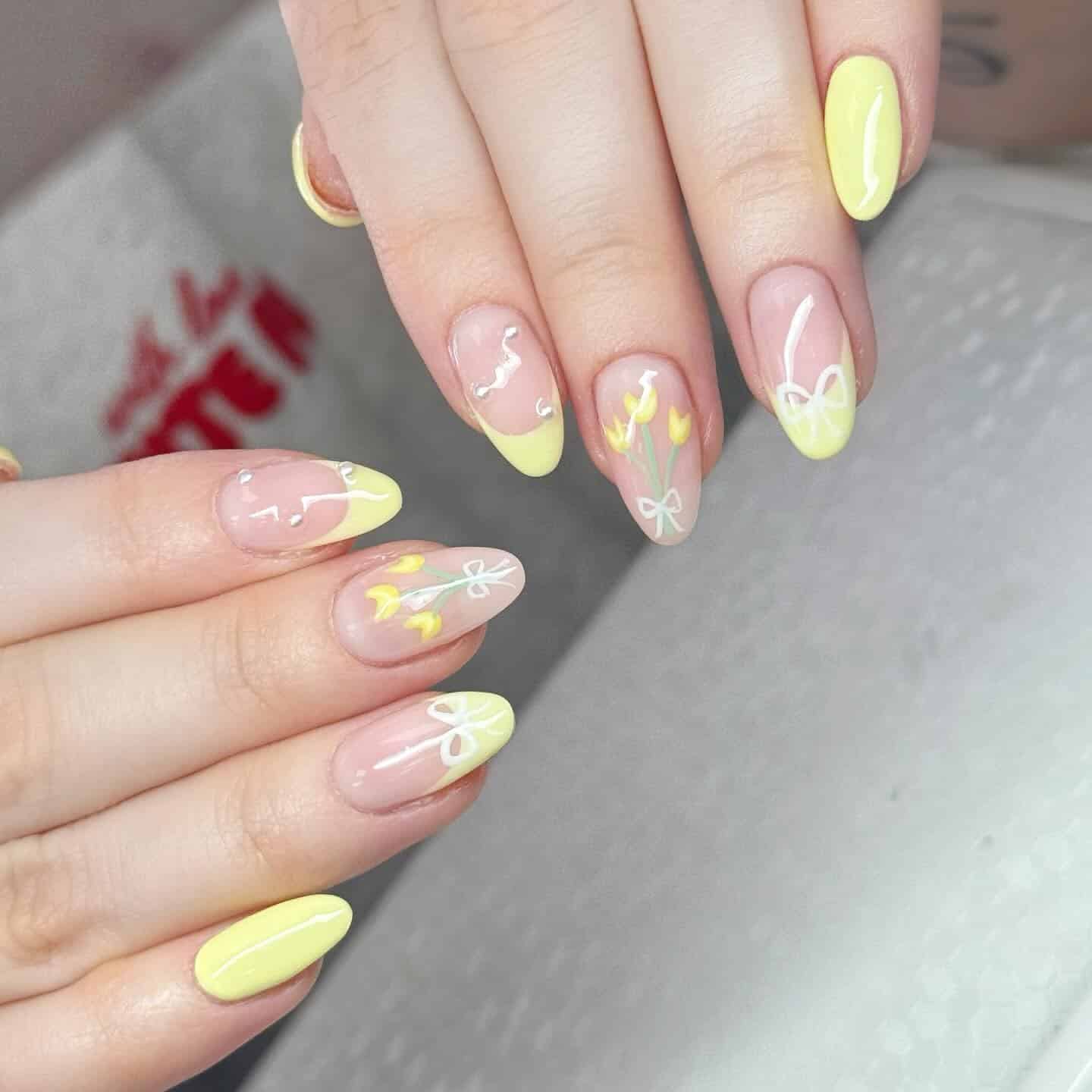 13. Butter Yellow Floral French Almond Nails - april nail ideas