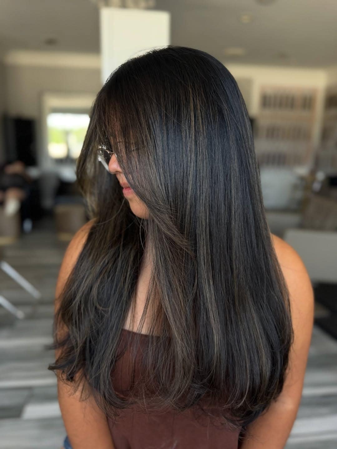 20. Soft Black Sleek Long Layers - Soft Black Hair Color