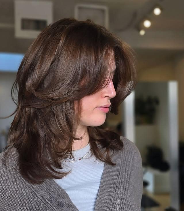 3. Medium Chocolate Brown Shaggy Layers with Curtain Bangs - Layered Hairstyles