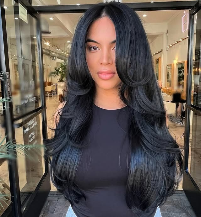 7. Soft Black Butterfly Layers with Curtain Bangs - Layered Hairstyles