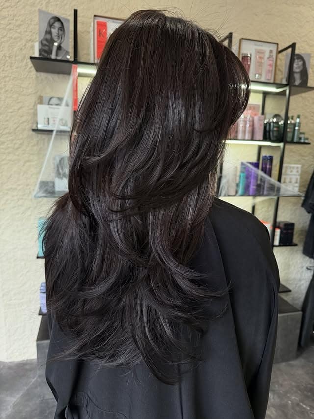 13. Glossy Soft Black Cascading Layers - Layered Hairstyles
