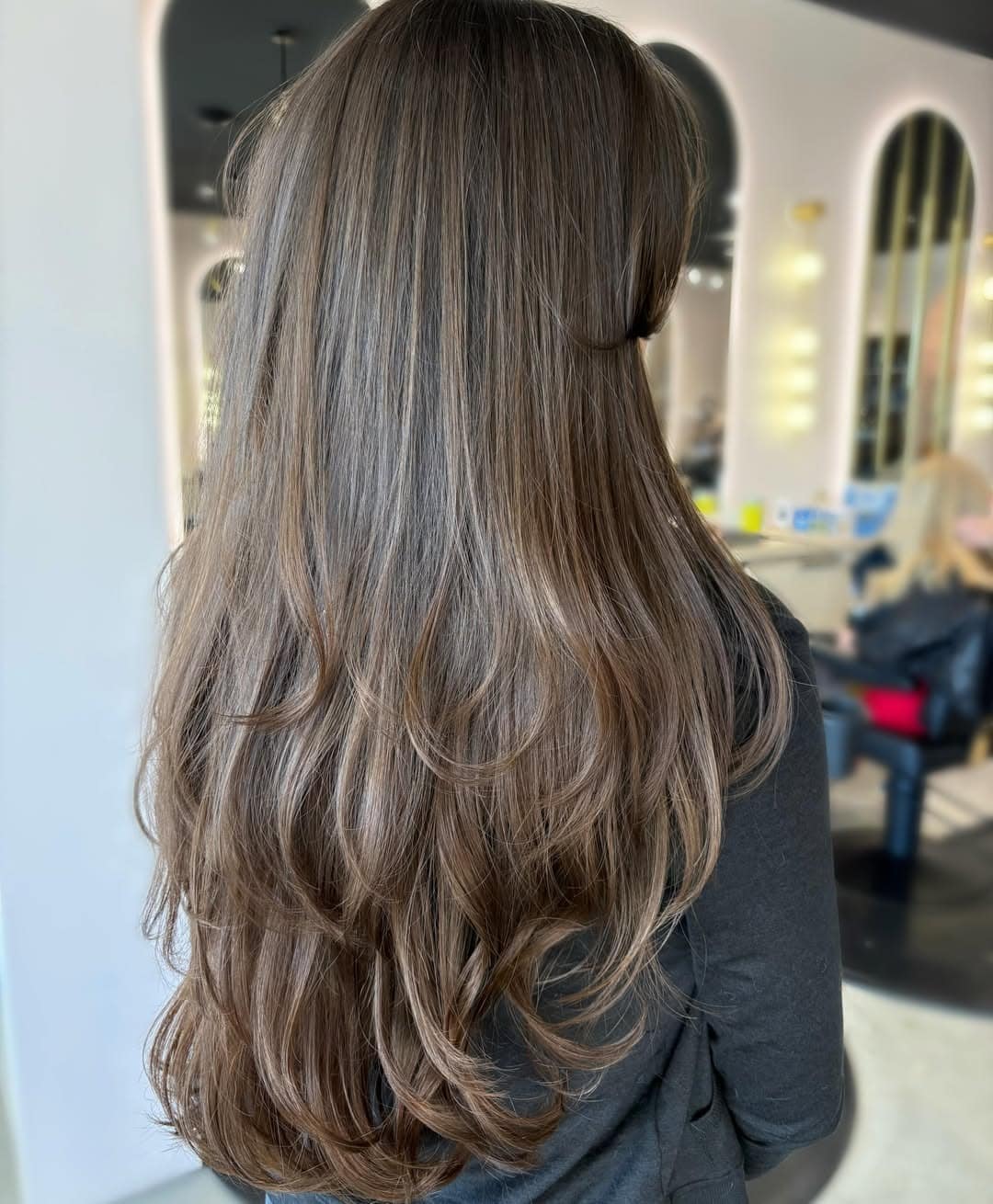 16. Cool Mocha Brown Long Layers with Wispy Face Framing - Layered Hairstyles