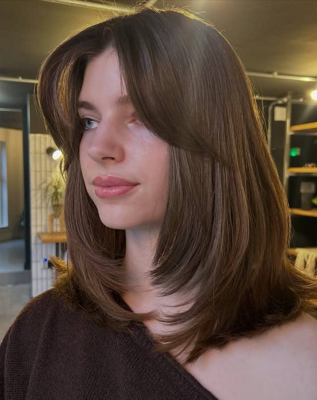 17. Medium Chocolate Brown Lob with Curtain Bangs - Layered Hairstyles