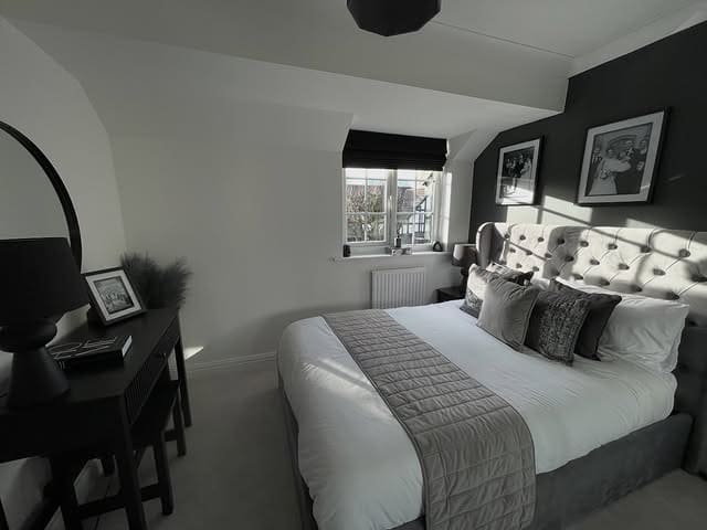 18. Compact Black, White and Silver Attic Bedroom - silver black bedroom ideas