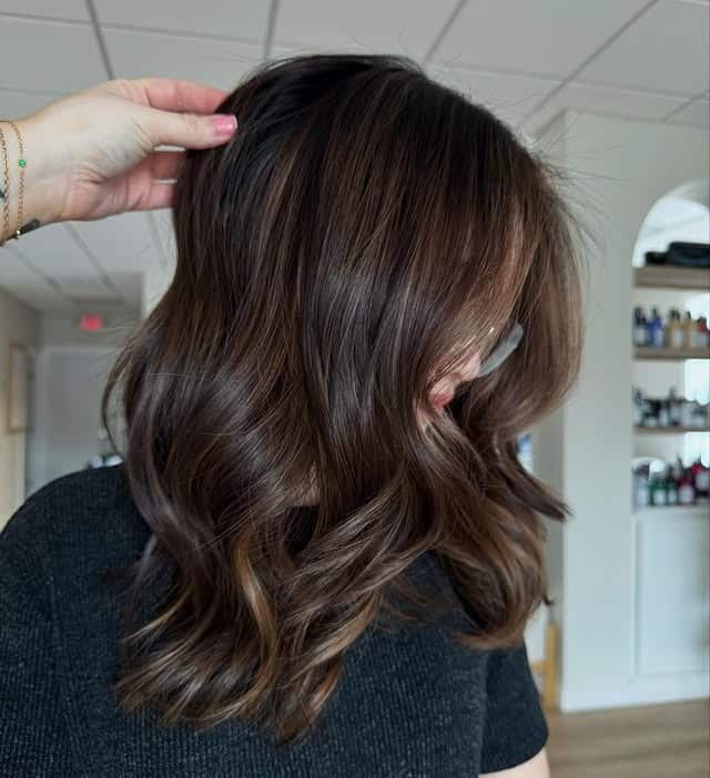15. Chocolate Bronde with Glossy Shoulder-Length Curls - Bronde Hair Color