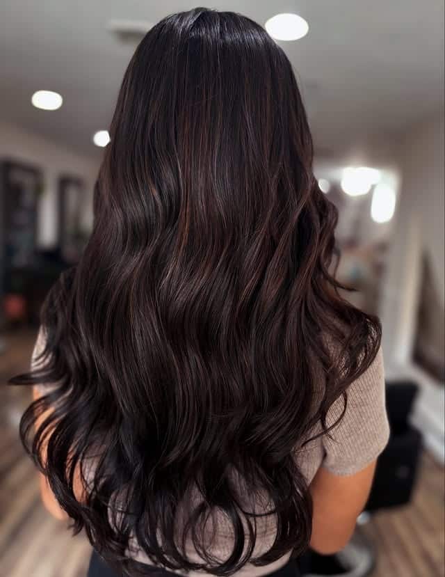1. Dark Chocolate Brown Long Waves - Warm Brown Hair Color