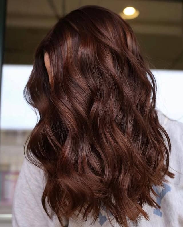 10. Mahogany Brown Tousled Waves - Warm Brown Hair Color