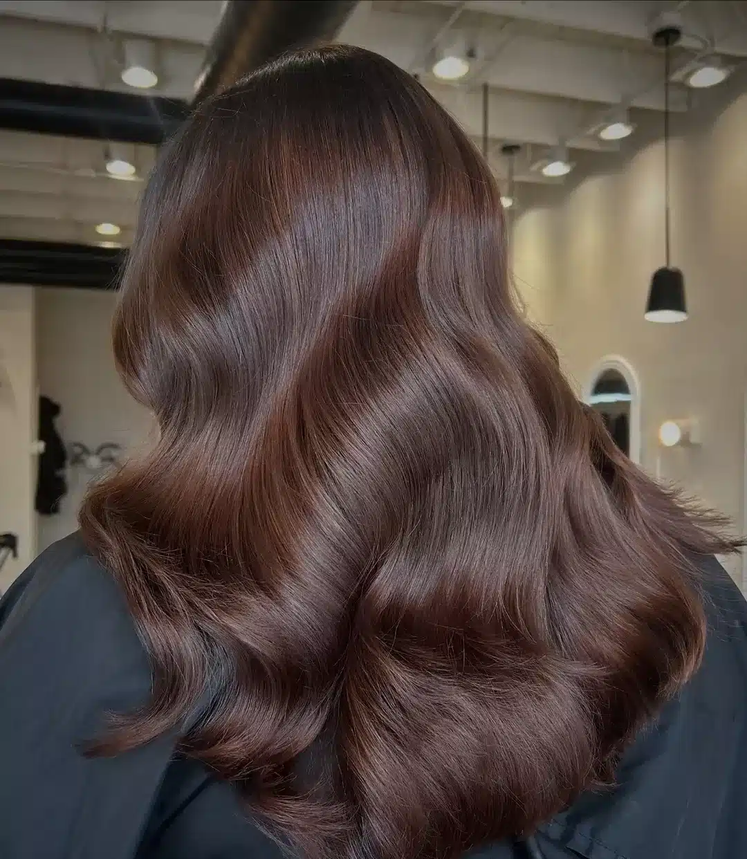 12. Deep Cocoa Brown Sculpted Waves - Warm Brown Hair Color