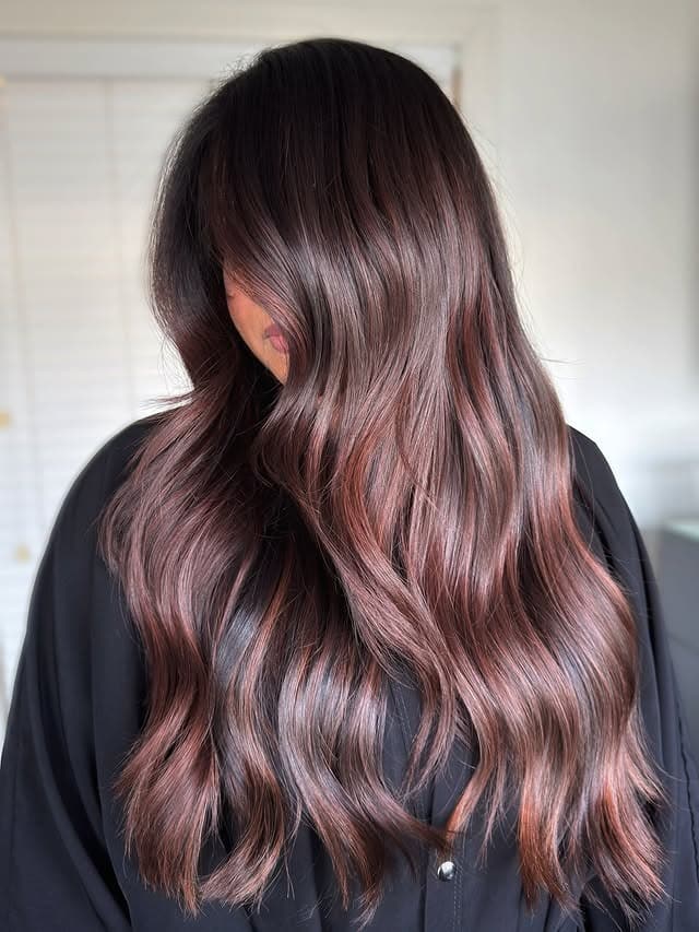 15. Rosewood Brown Long Glossy Waves - Warm Brown Hair Color